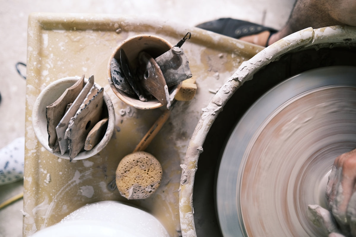 pottery wheel with clay tools and sponge